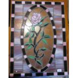 A decorative leaded and stain glass window pane.