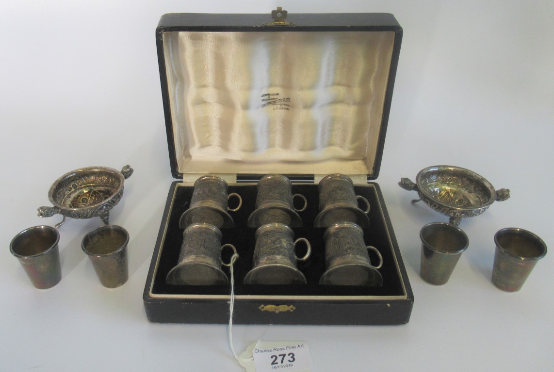 A cased set of miniature sterling silver glass bottom tankards,