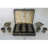 A cased set of miniature sterling silver glass bottom tankards,
