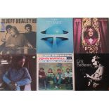 A collection of sixteen vinyl LP's, to include: Robert Cray, John Mayall, Robin Trower,