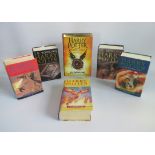Two boxes containing twelve Harry Potter volumes, to include: The Half Blood Prince,