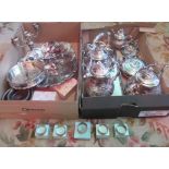 Two boxes containing a large quantity of silver plate,