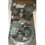 A box containing a large quantity of pewter.