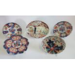 A collection of five 19th century Imari dishes, typically decorated in the Oriental palette,