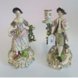 A pair of Continental figurines in the form of candle holders (one AF).
