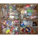 Four boxes containing a large quantity of miscellaneous fast food advertising toys.