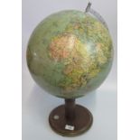 A 20th century terrestrial globe with inset compass to base.
