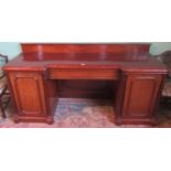 A Victorian mahogany pedestal sideboard.