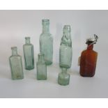 A collection of seven various vintage bottles.