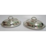 A matching pair of 19th century hallmarked oval lidded entree dishes.