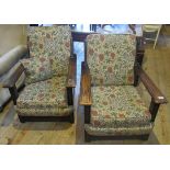 A pair of 20th century oak armchairs.