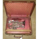 A Rudall Carte & Company cornet, no. 5638 in a leather case.