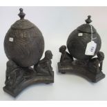 A Port Blair carved coconut cup & cover on stand, together with one other, similar.