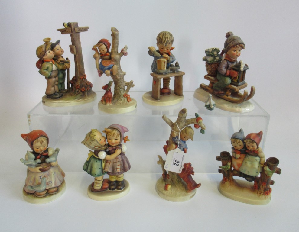 A collection of eight various Hummel figures.