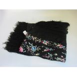 A Victorian black crepe shawl with floral decoration.