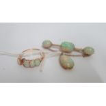 An opal brooch/pendant, together with a matching opal ring.