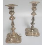 A pair of early 20th century hallmarked candlesticks, Sheffield 1909.