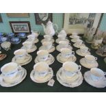 A Royal Doulton Monteigne tea service, comprising: six trios, teapot, milk jug,