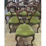 A set of six 19th century rosewood cabriole legged dining chairs.