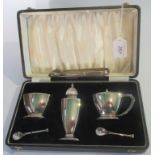 A cased Art Deco hallmarked three piece table cruet,