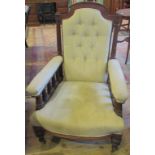 An Edwardian mahogany framed and upholstered fireside chair.