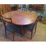 A mid-20th century G-Plan style extending table and six chairs.