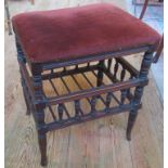 An Edwardian turned wood and upholstered music/piano stool.