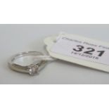 A single stone diamond ring, the brilliant cut diamond in four claw mount,