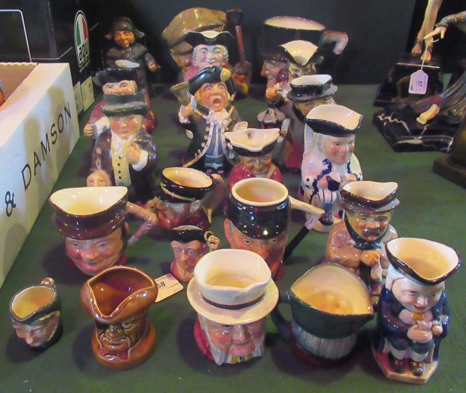 A collection of twenty-two various character and Toby jugs.