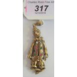 A 9 carat gold articulated clown pendant, set with coloured stones, 20.5g.