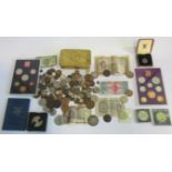A box containing a quantity of various coins, proof sets and a Queen Mary 1914 xmas tin.