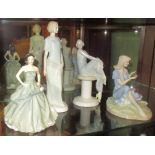 A collection of four Royal Doulton figurines, comprising: Happy Birthday 2013 HN5587, Enigma HN3110,