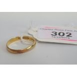 A 22 carat gold plain wedding band, ring size 'R', 2.6g.