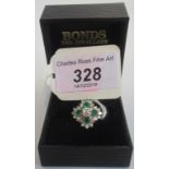 An emerald and diamond cluster ring,