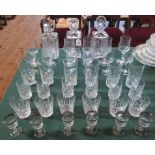 A collection of glassware, to include: three decanters, sherry and port glasses, whisky tumblers,