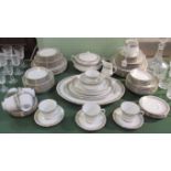 A Noritake twelve place setting dinner service, comprising: dinner plates, side plates,