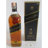 A 1 litre bottle of 12 year old Johnnie Walker Black Label Old Scotch Whisky.