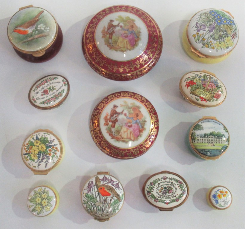 A collection of twelve porcelain and enamel boxes, to include Halcyon Days.