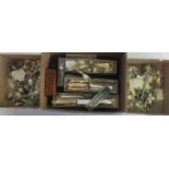 Three boxes containing a large quantity of silver and silver plated flatware and teaspoons.