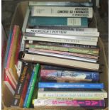 A box containing a large quantity of antique reference books.