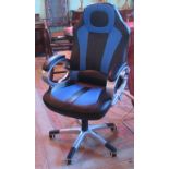 A 21st century swivel office chair in blue and black upholstery.