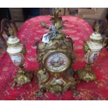 A late 19th/early 20th century gilt metal clock garniture,