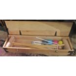 A contemporary croquet set in a pine case.