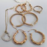 A pair of textured 9 carat gold hooped earrings, a ring and a pendant, gross weight 8g.
