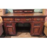 A walnut ebonised and inlaid kneehole desk,