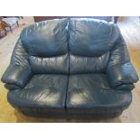 A contemporary blue leather two seater sofa.