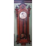 A late Victorian mahogany and ebonised single weight Vienna wall clock.