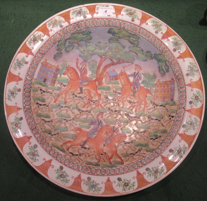 A large contemporary Chinese bowl, with a hunting scene decoration on a rust and grey ground.