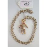 A 9 carat gold articulated teddy bear pendant and associated open link chain, 33.6g.