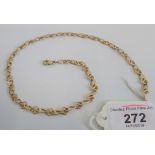 A Italian fancy link necklace of interlocking tiered links, stamped 375, 43cm long, 15.2g.